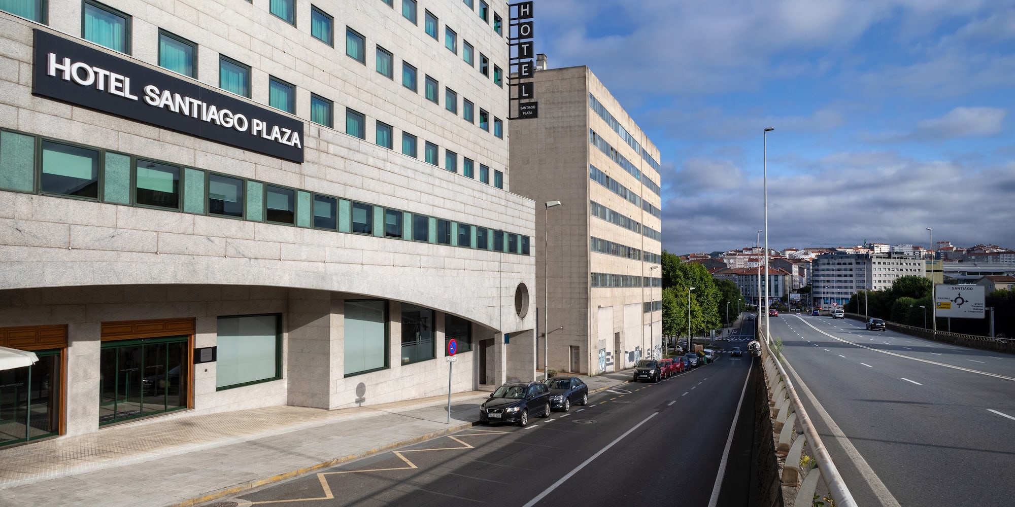 a street with cars and buildings
