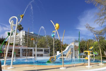 a water park with a slide and a slide