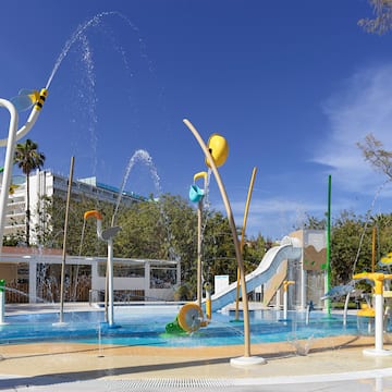 a water park with a slide and a slide