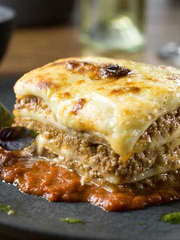 a plate of lasagna on a table