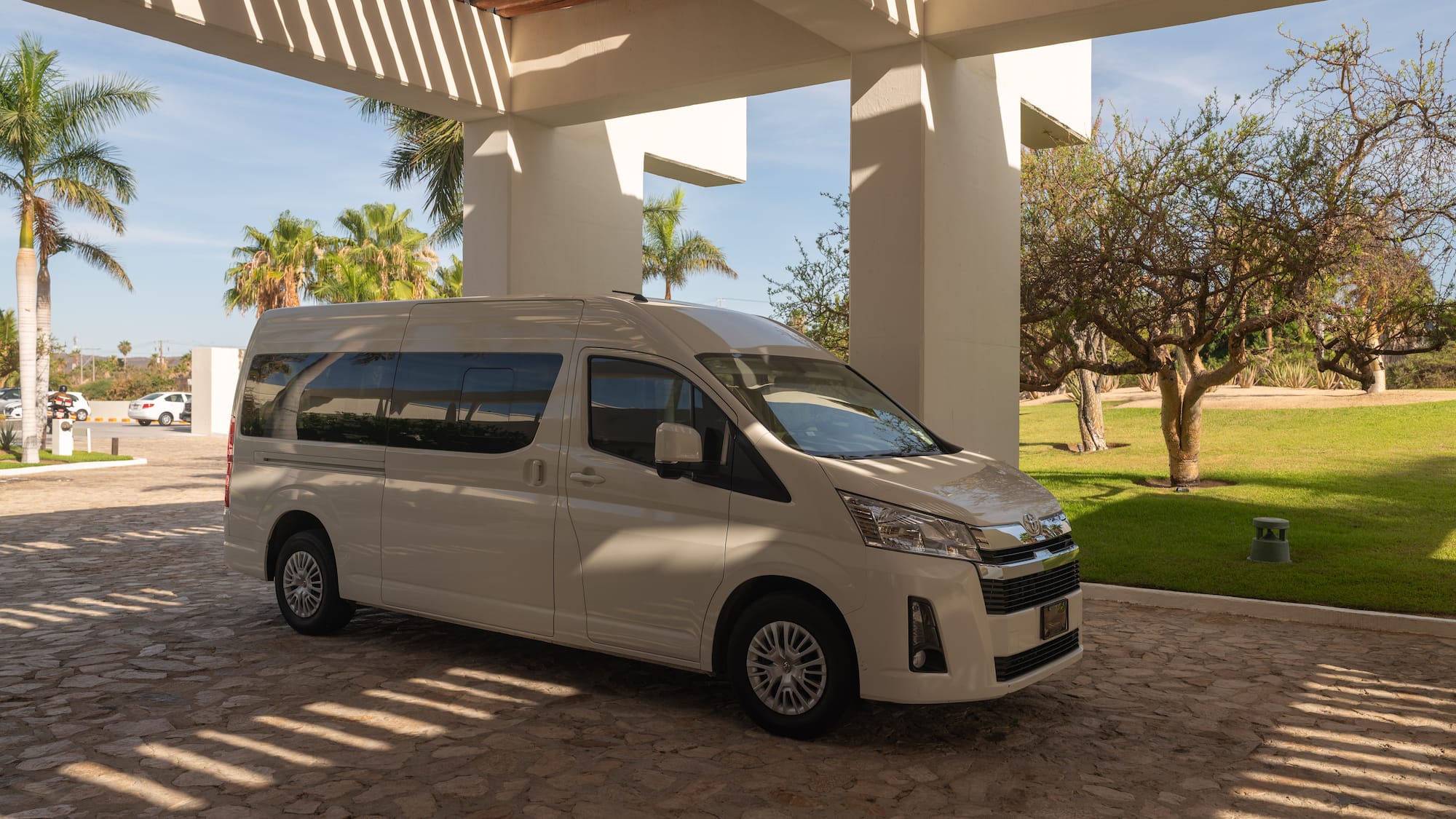 a white van parked under a covered patio