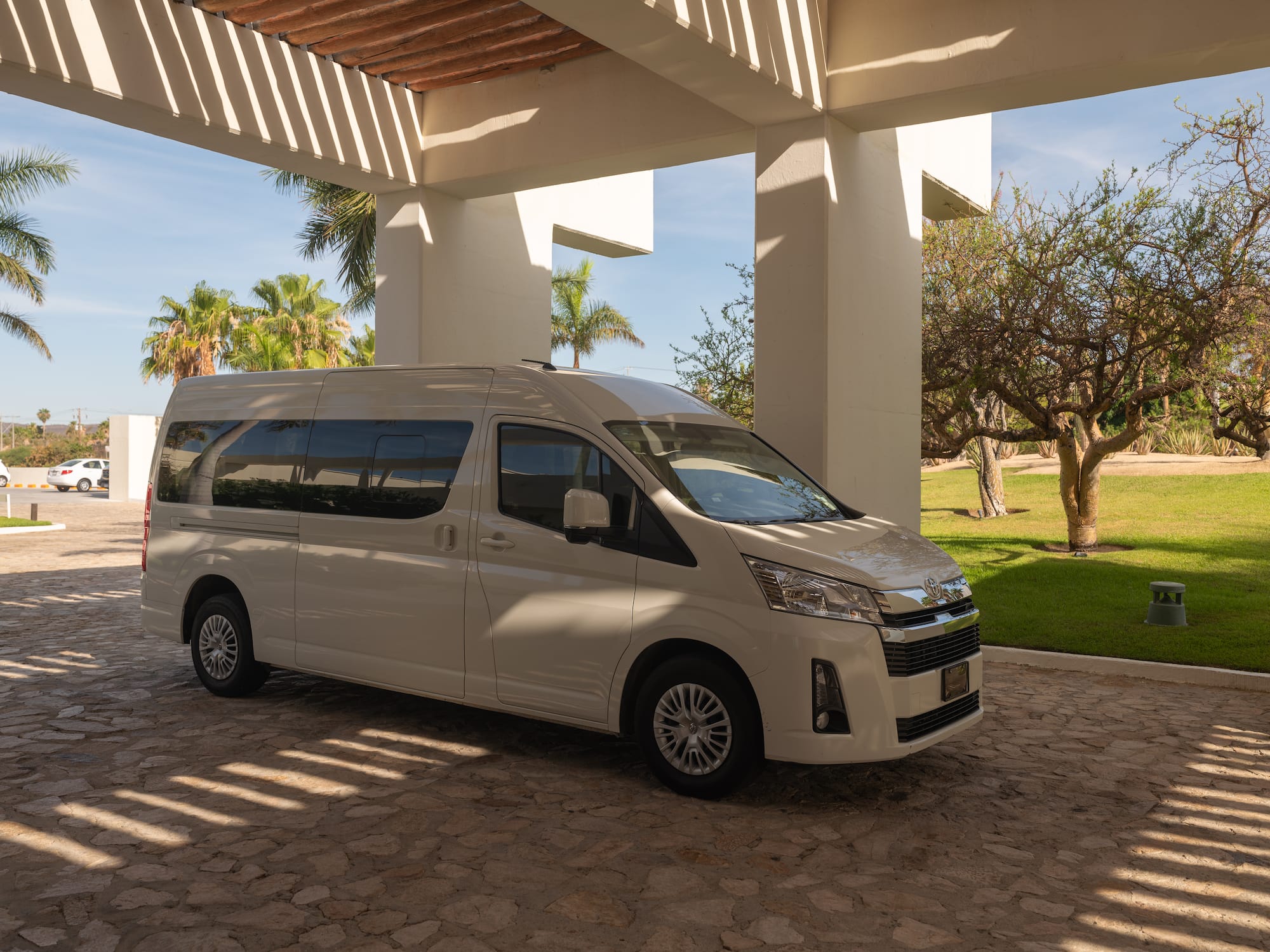 a white van parked under a covered patio