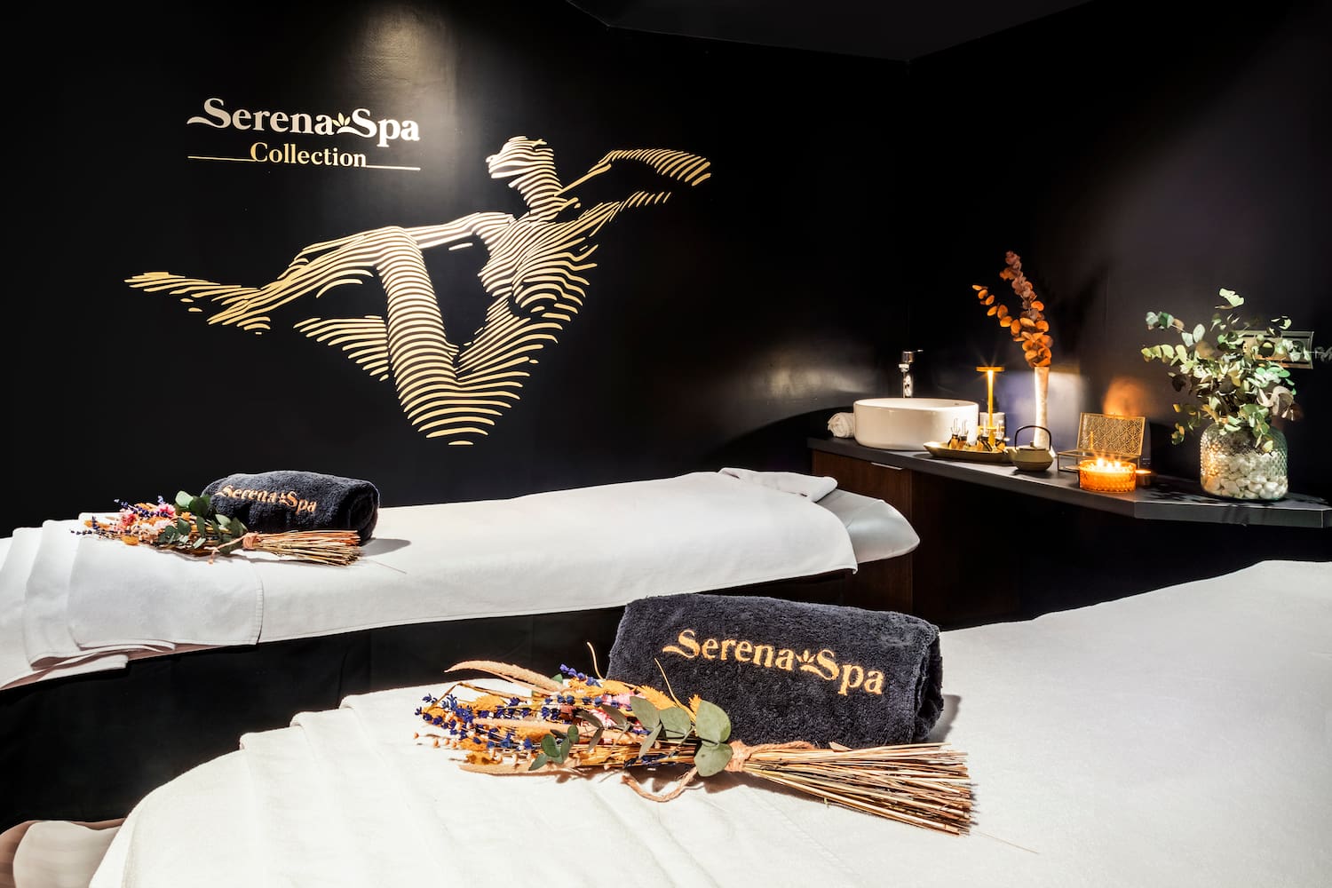 a massage room with towels and towels