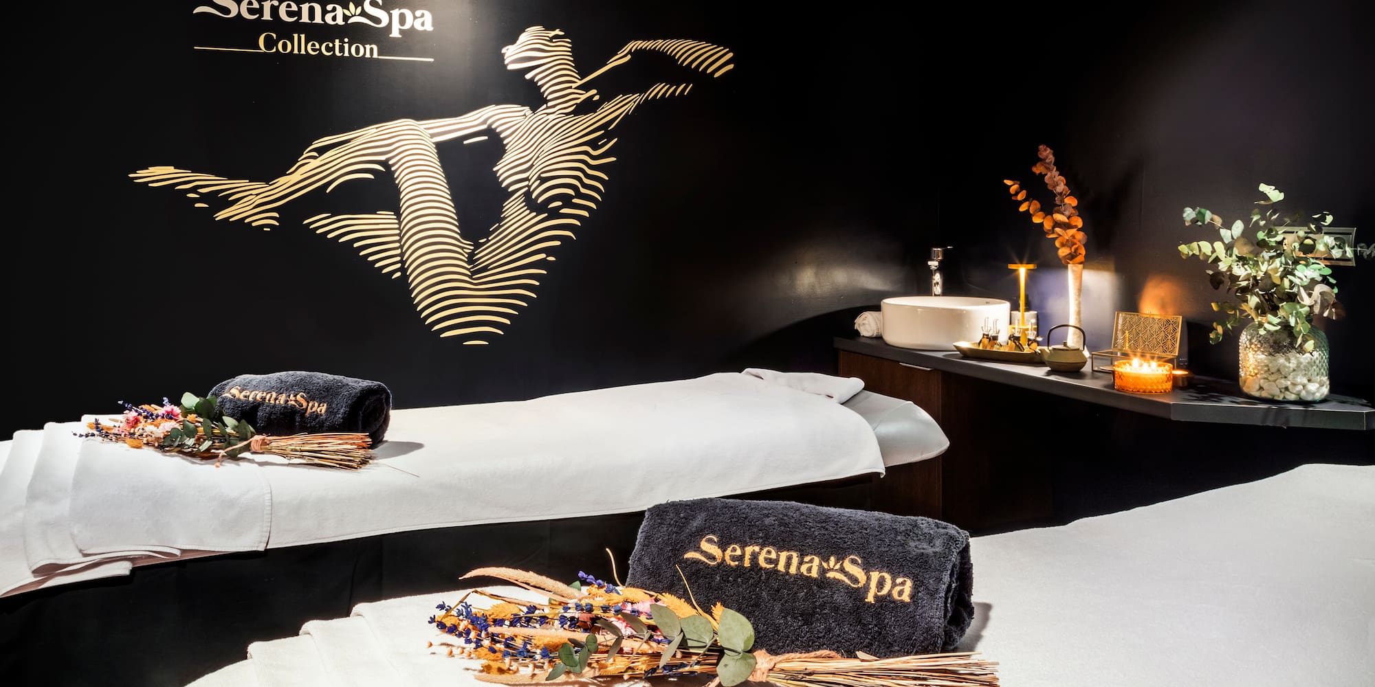 a massage room with towels and towels