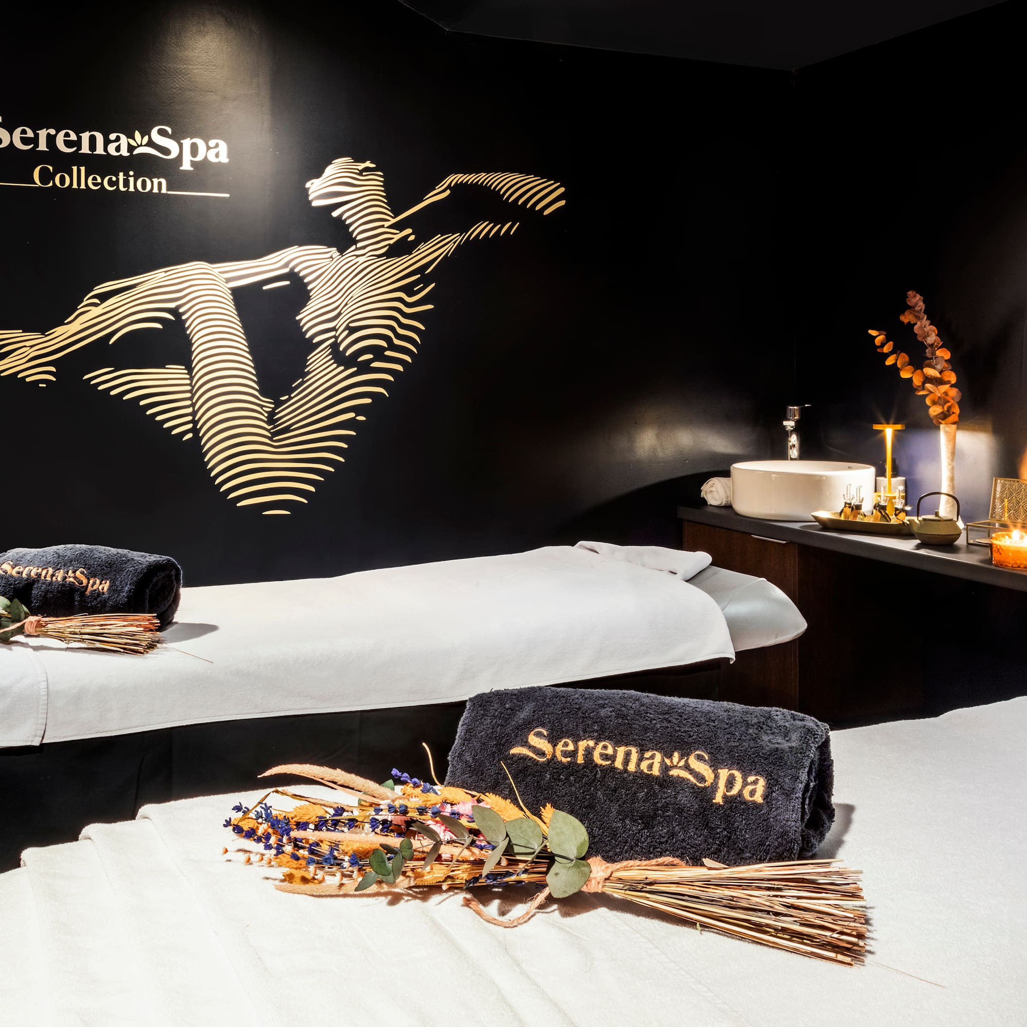 a massage room with towels and towels