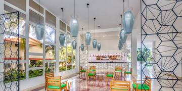 a room with chairs and tables