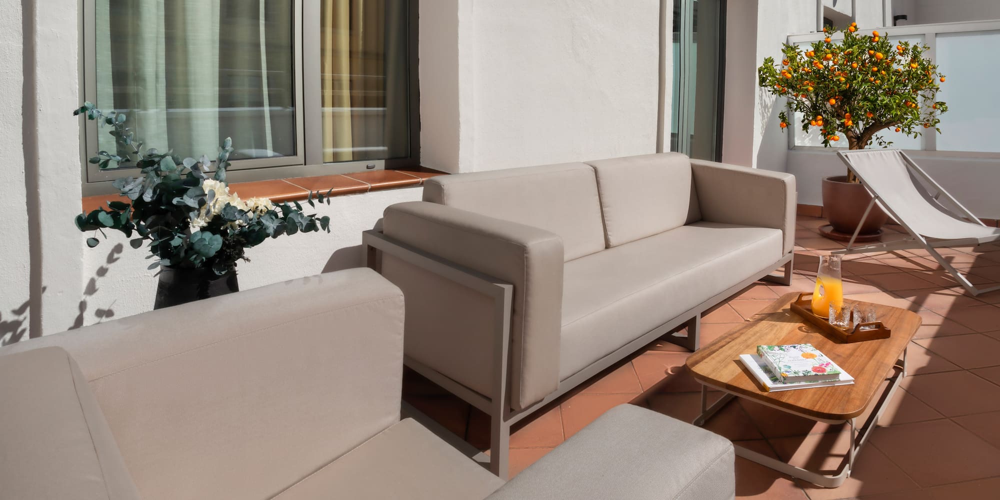 a couches and chairs on a patio