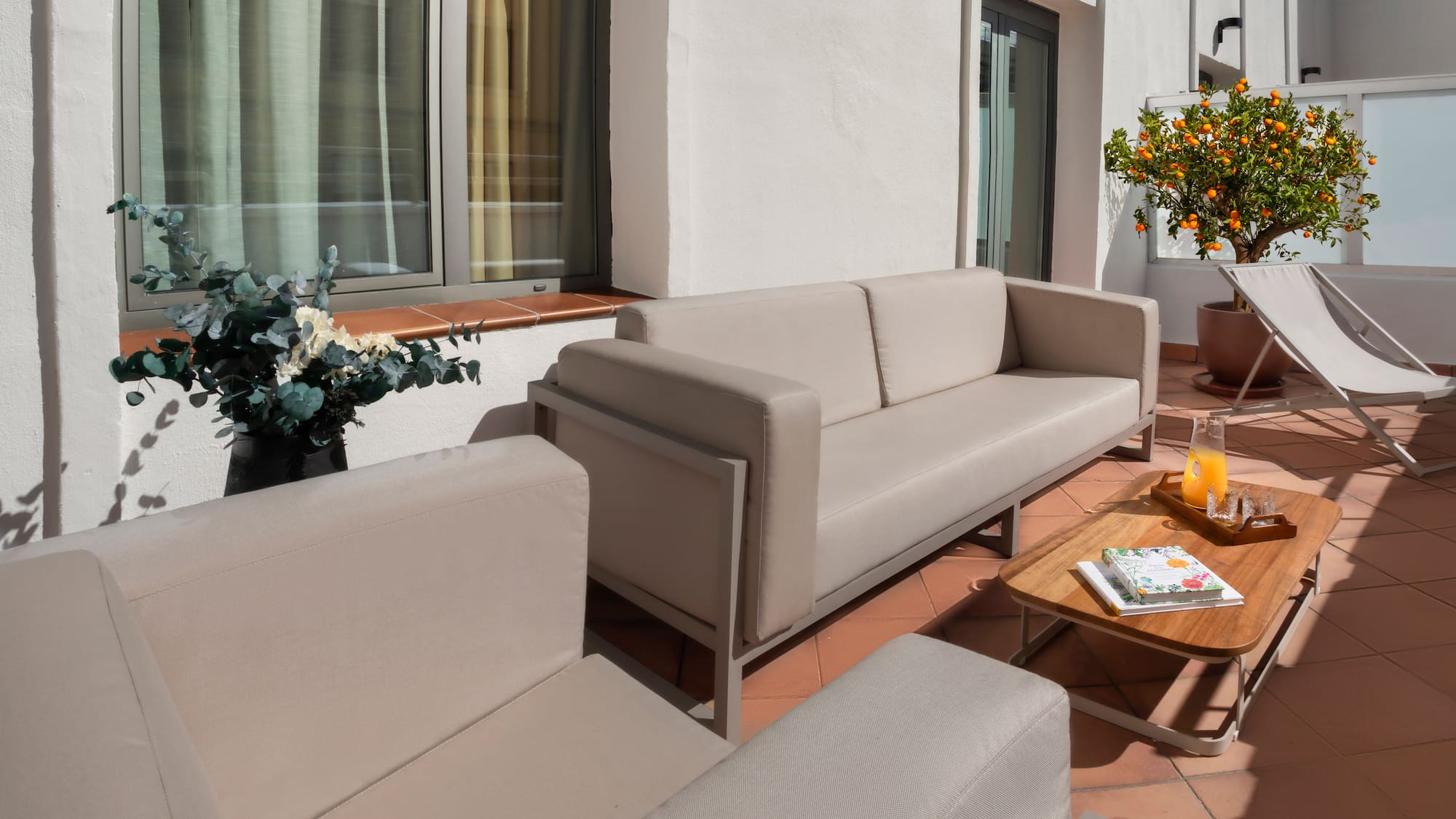 a couches and chairs on a patio