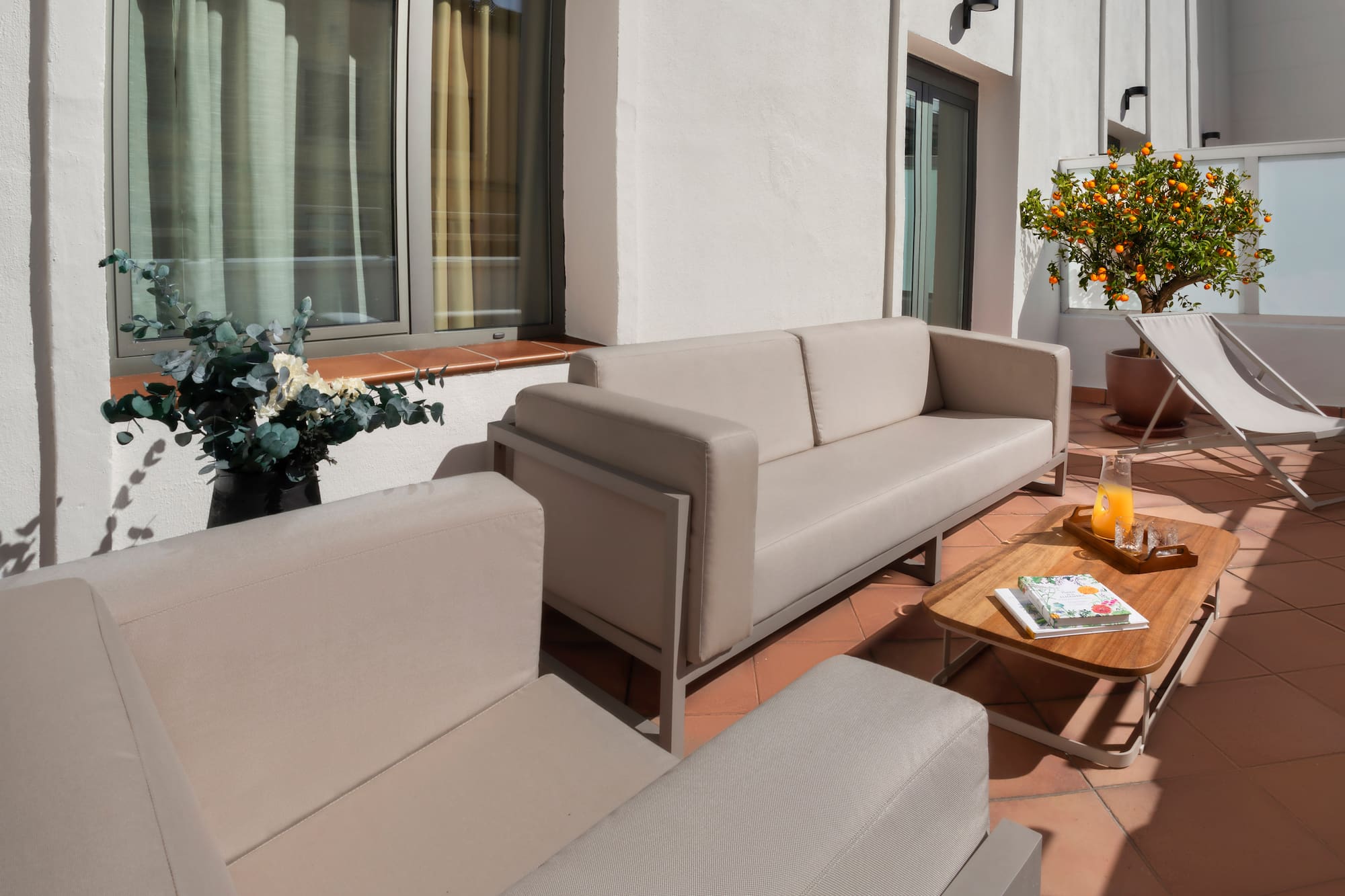 a couches and chairs on a patio