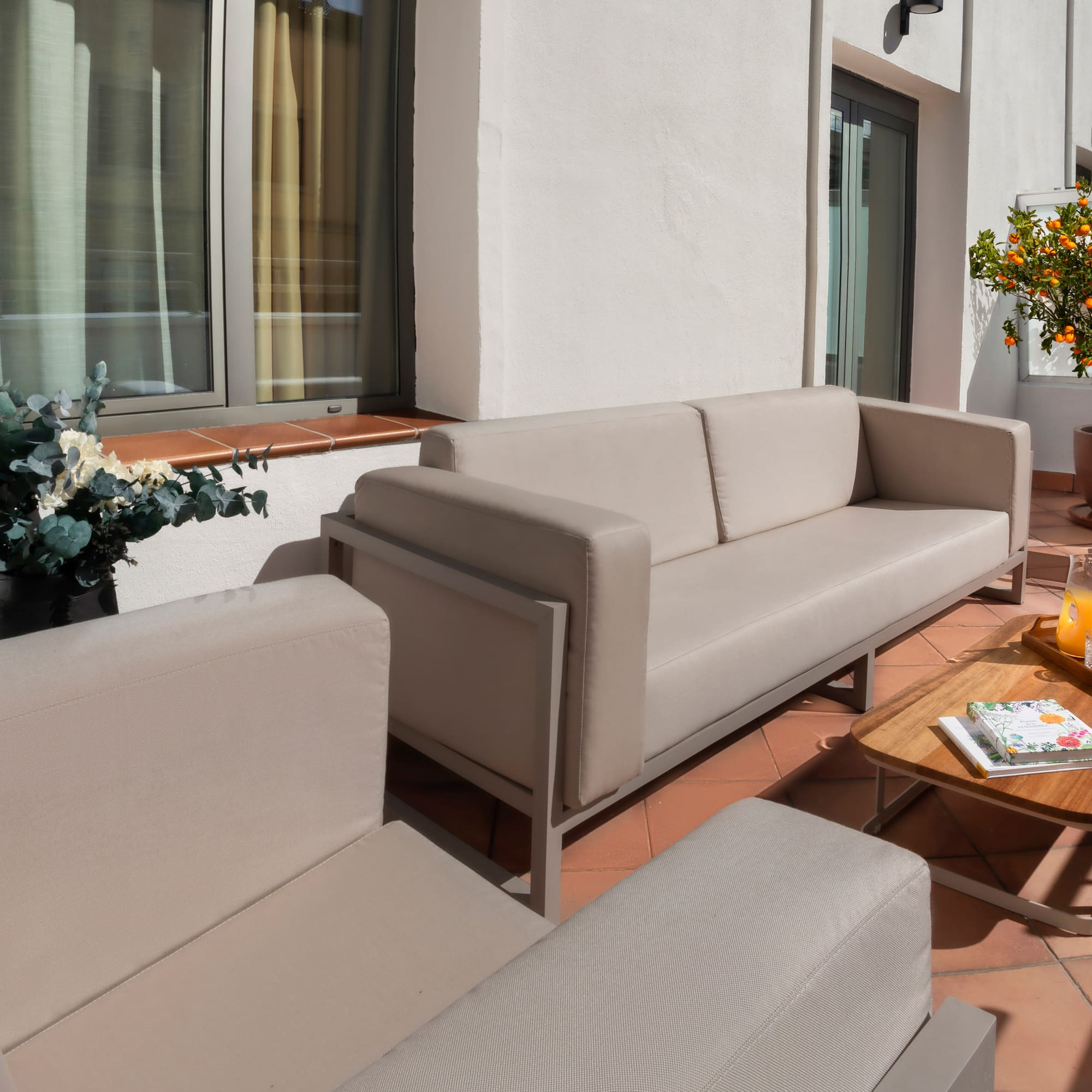 a couches and chairs on a patio