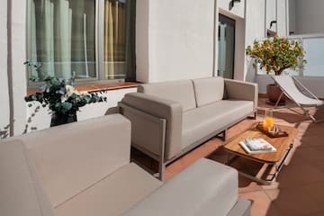 a couches and chairs on a patio