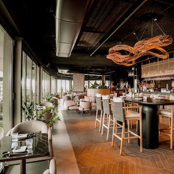 a restaurant with tables and chairs