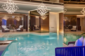 a swimming pool with a chandelier