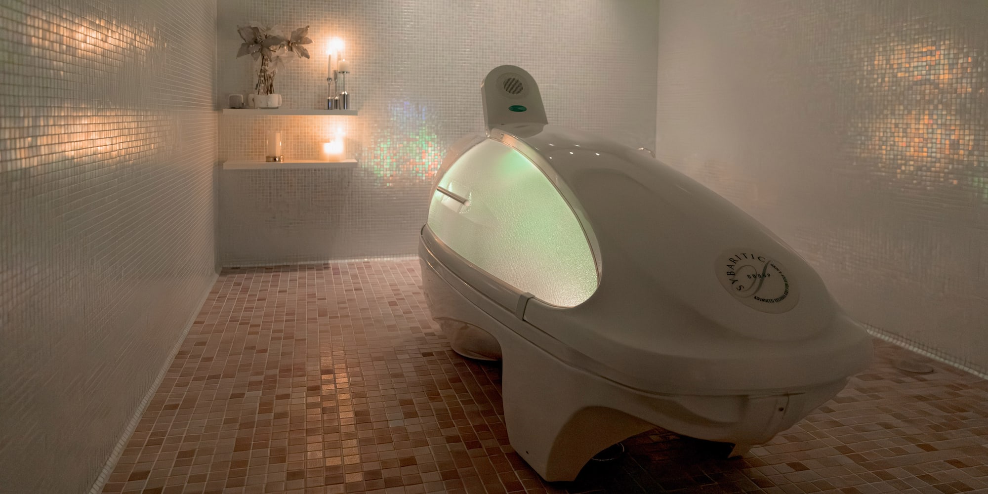 a white oval shaped object in a tiled room