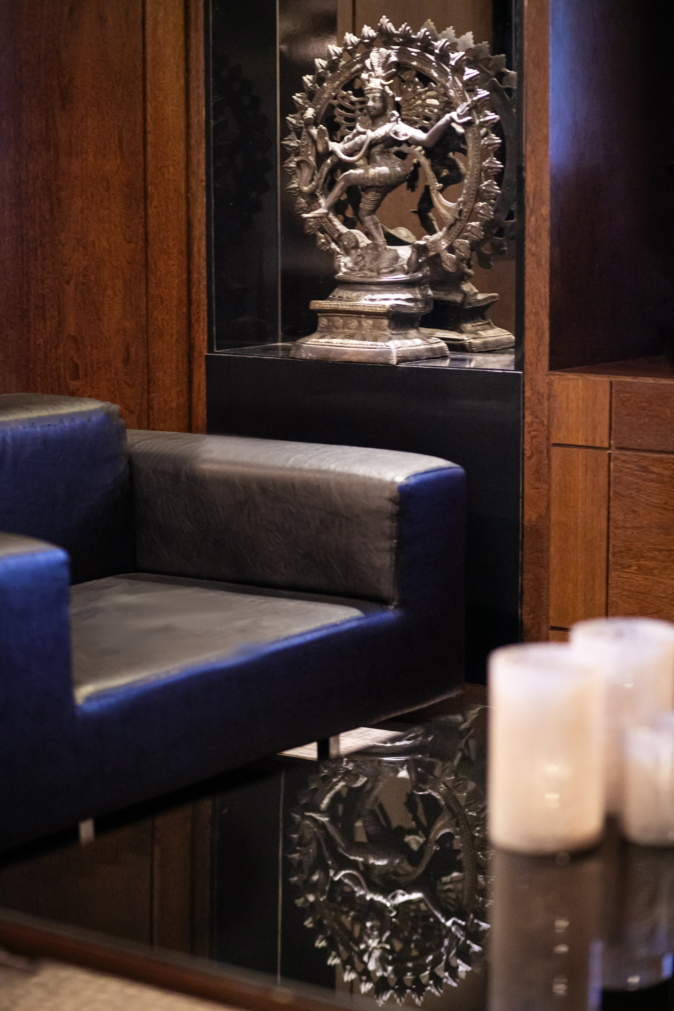 a statue in a glass case