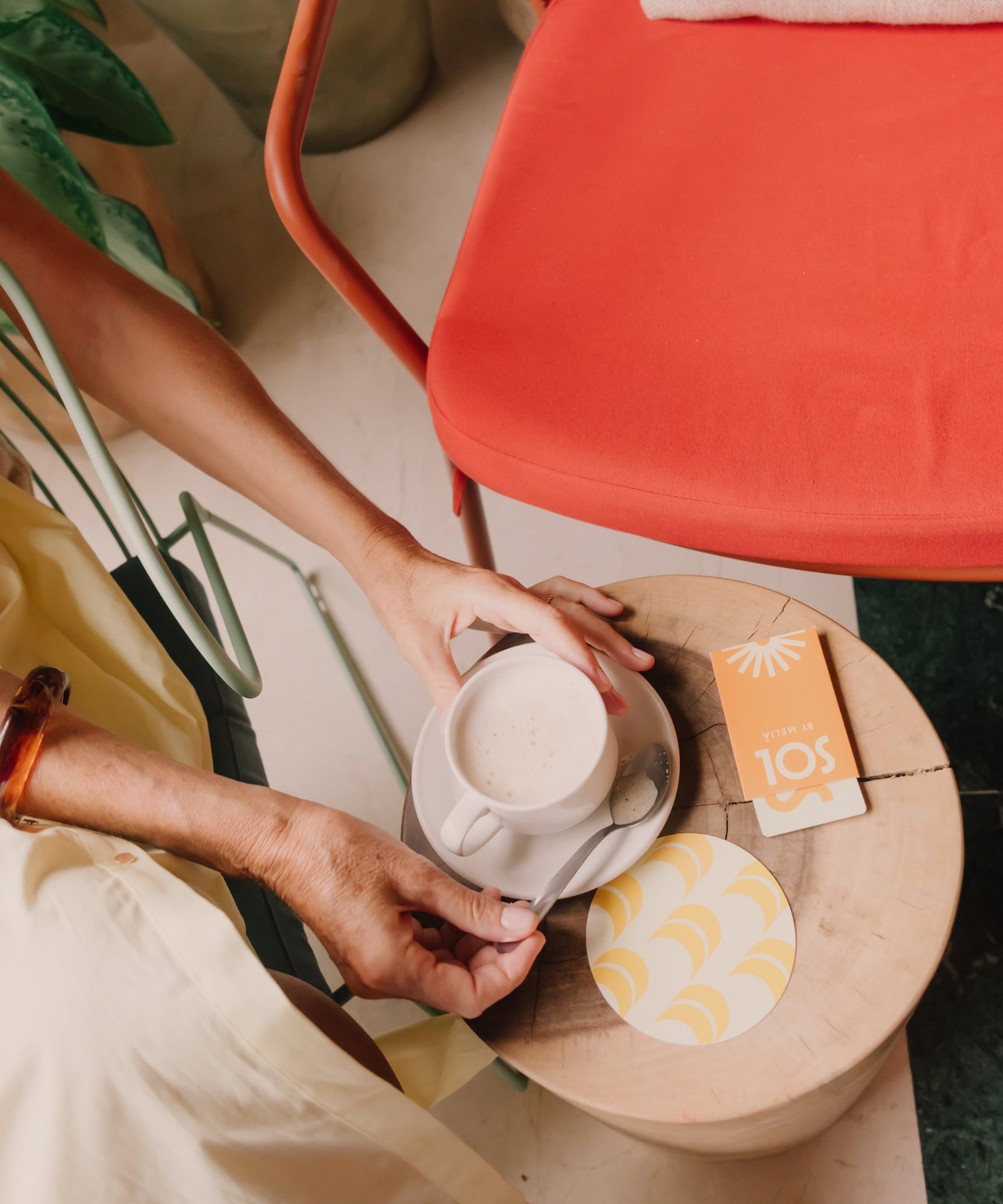 a person holding a cup of coffee