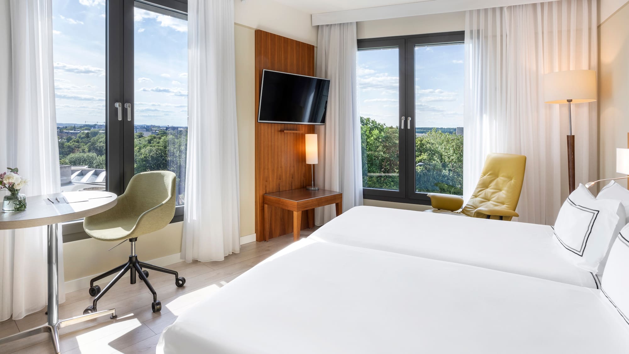 a room with a bed and a television