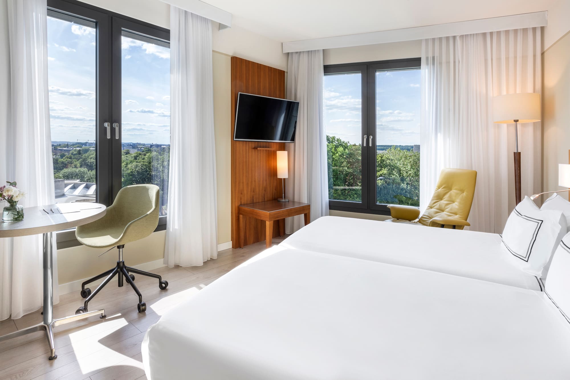 a room with a bed and a television