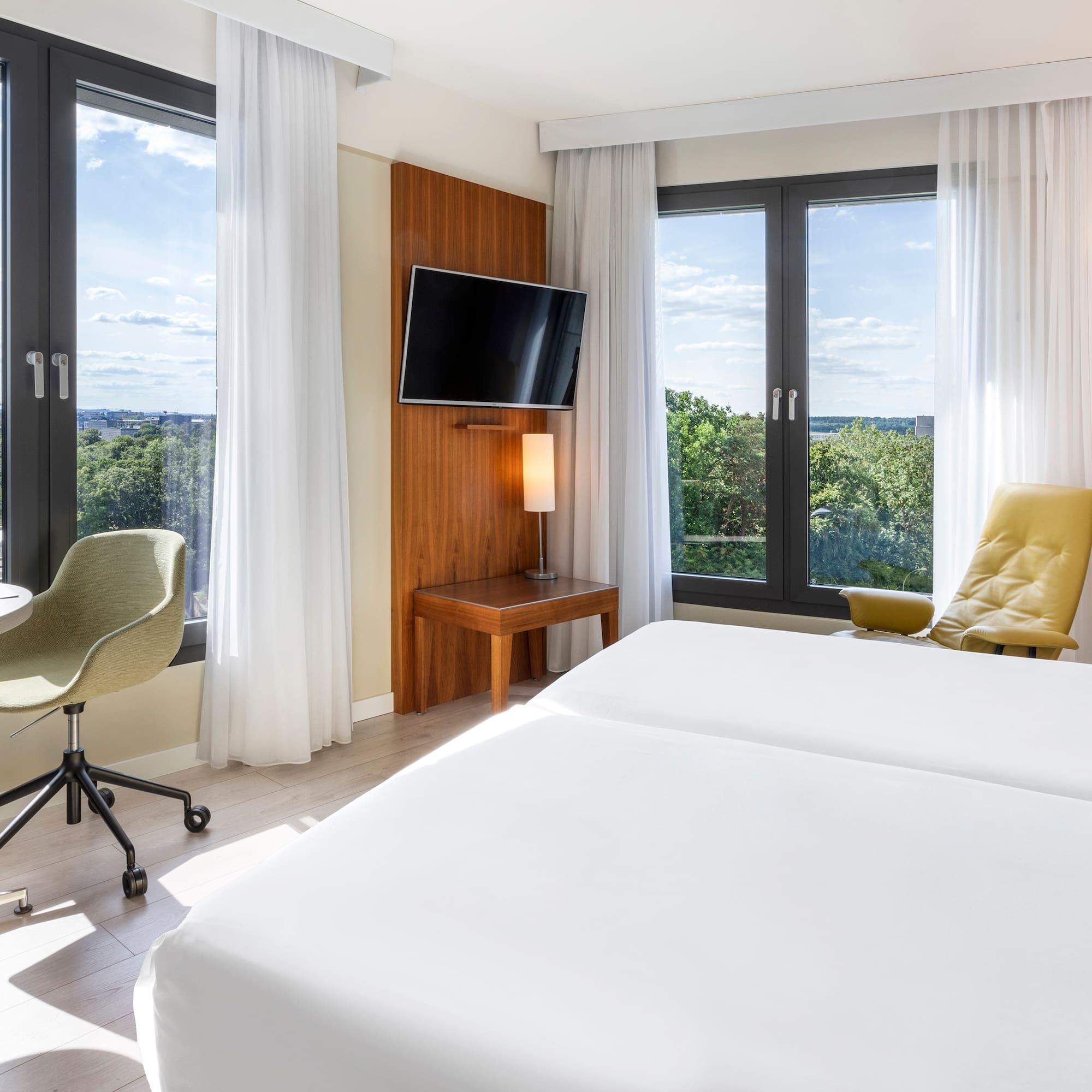 a room with a bed and a television