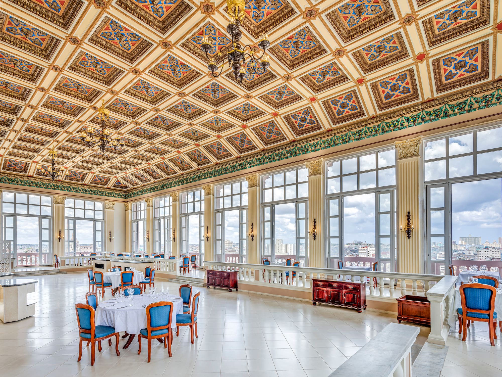 a large room with many windows and tables