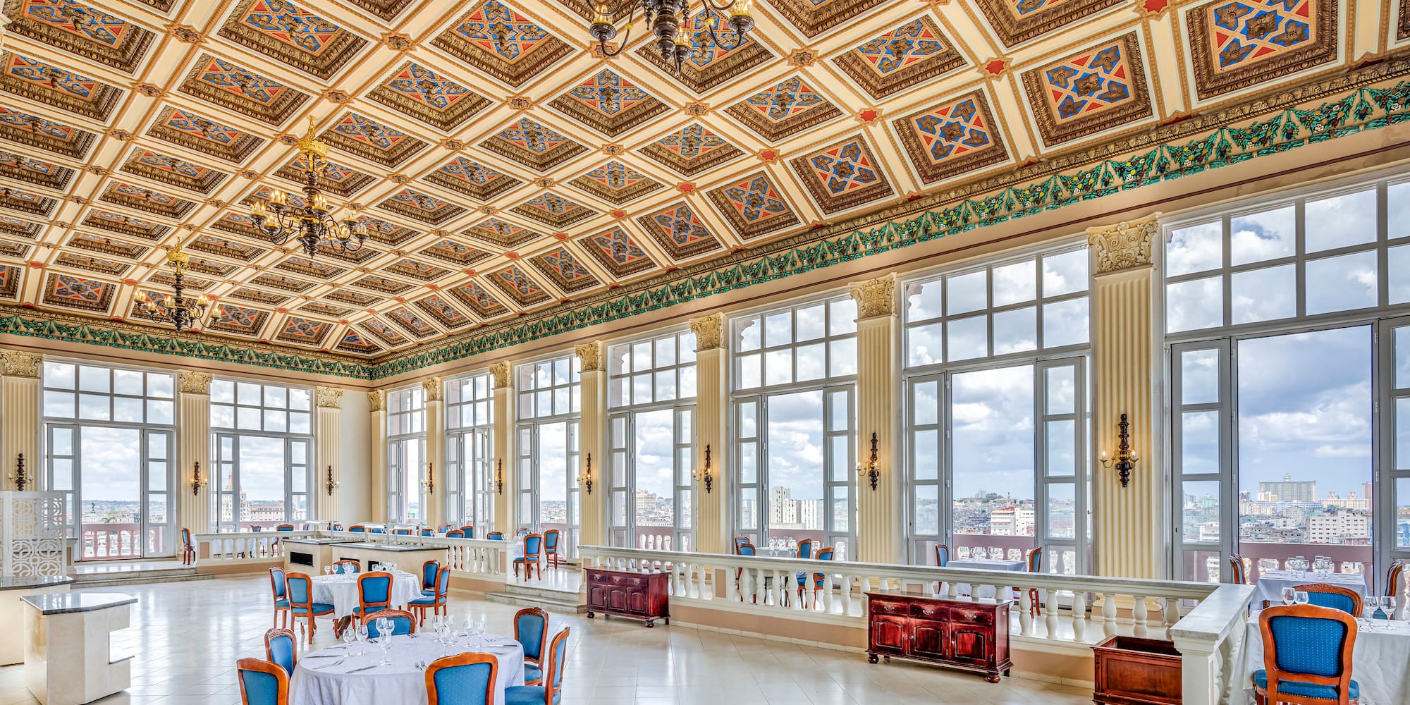 a large room with many windows and tables