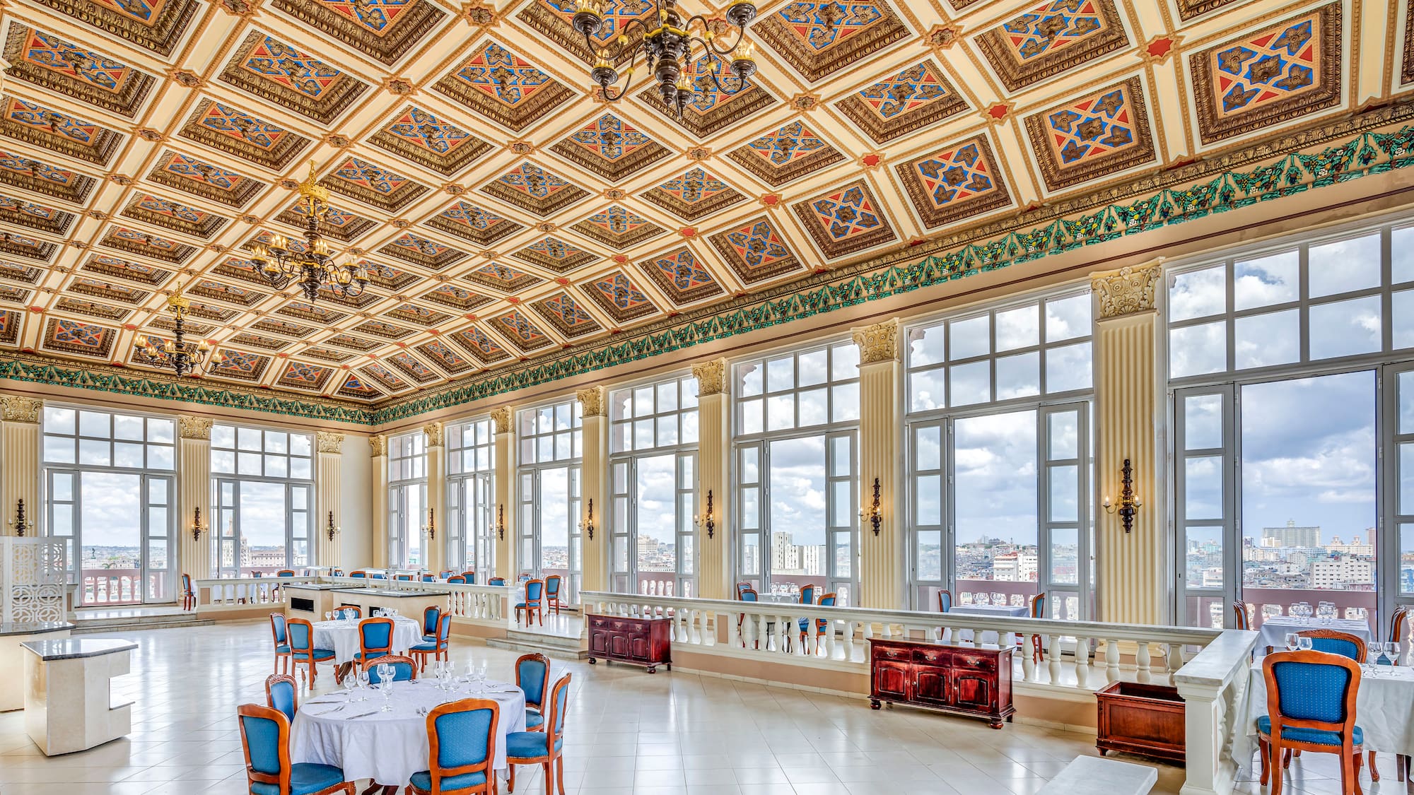 a large room with many windows and tables