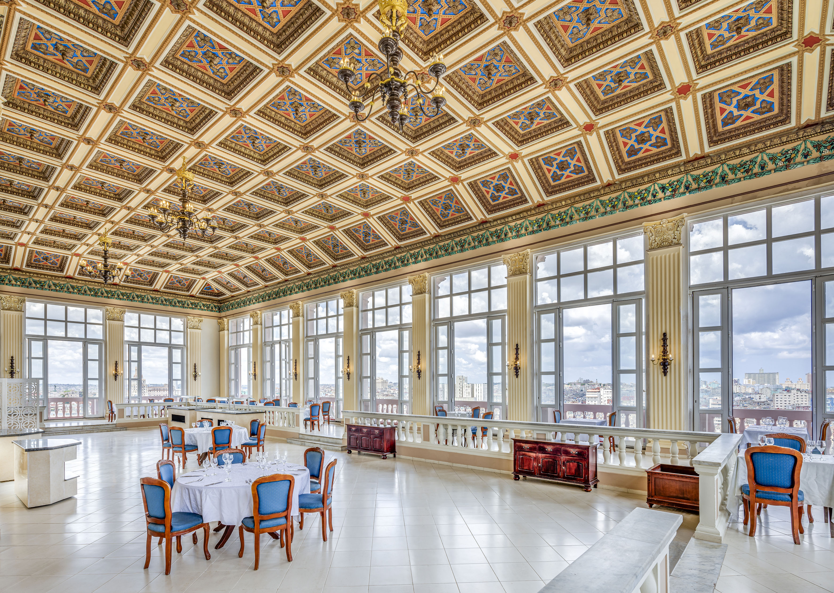 a large room with many windows and tables