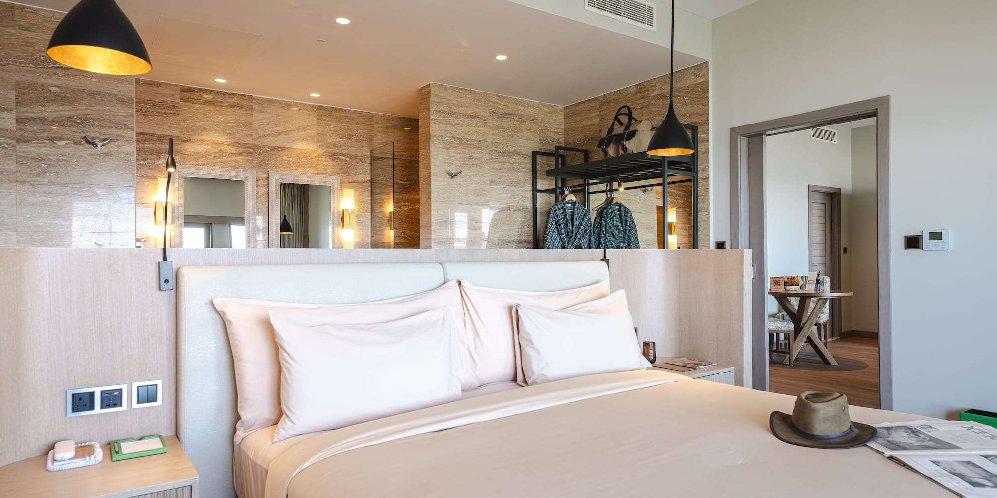 a bed with a hat on it