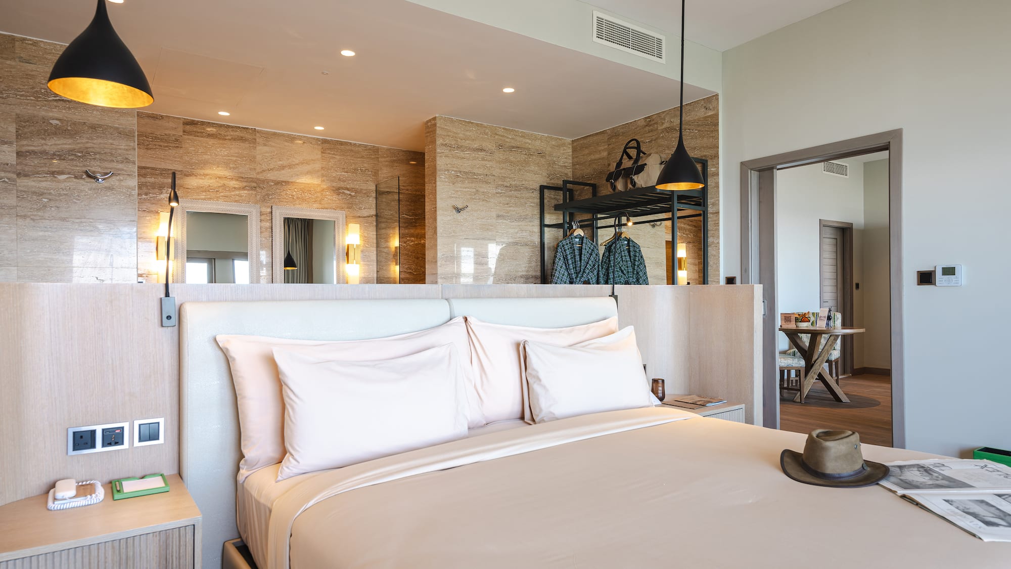 a bed with a hat on it