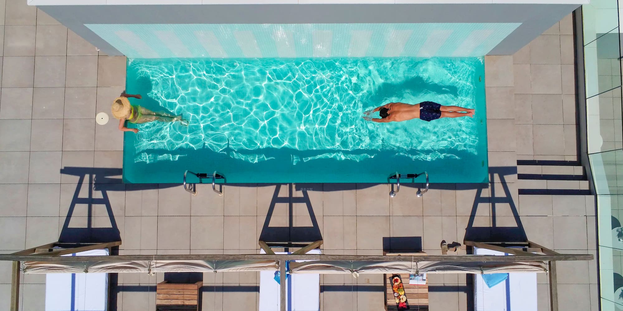 a group of people swimming in a pool