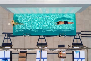 a group of people swimming in a pool