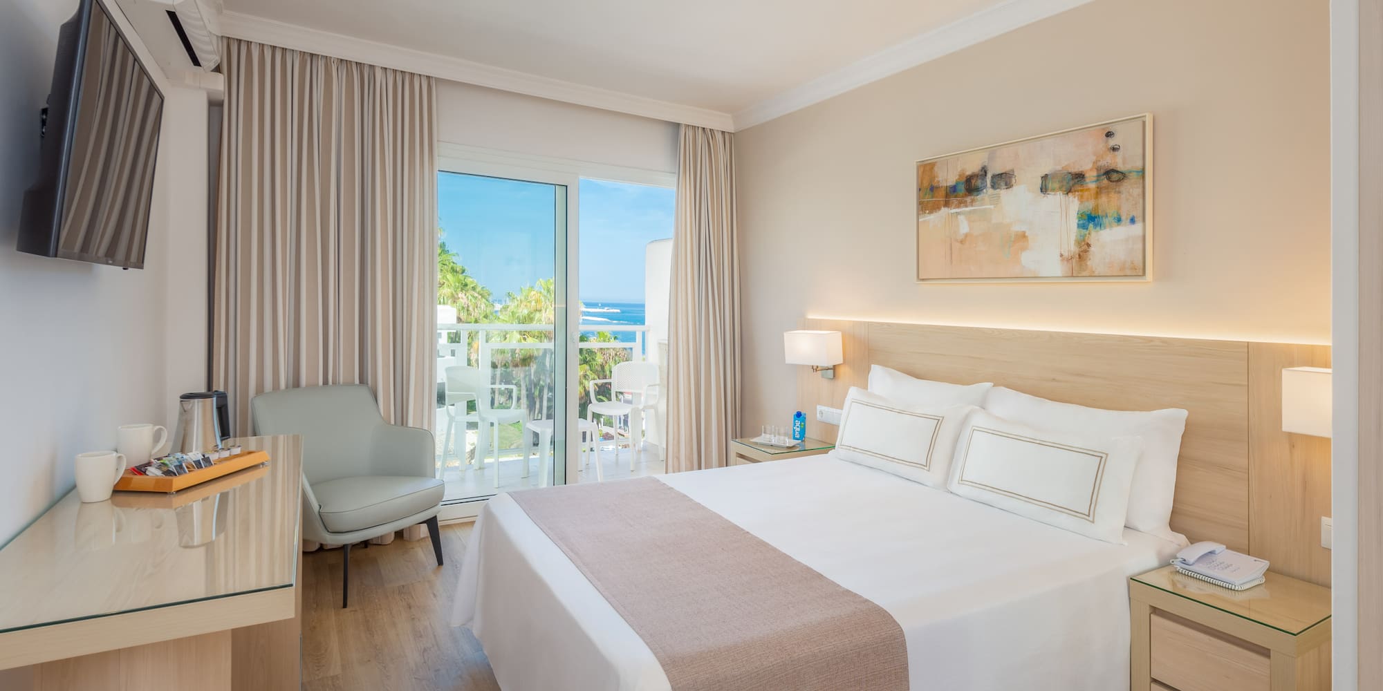 a bedroom with a bed and a desk and chair