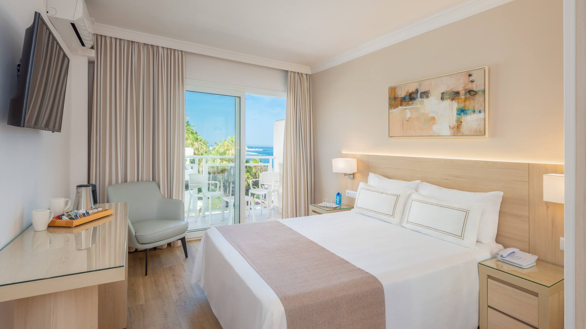 a bedroom with a bed and a desk and chair