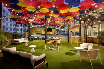 a patio with colorful umbrellas and tables