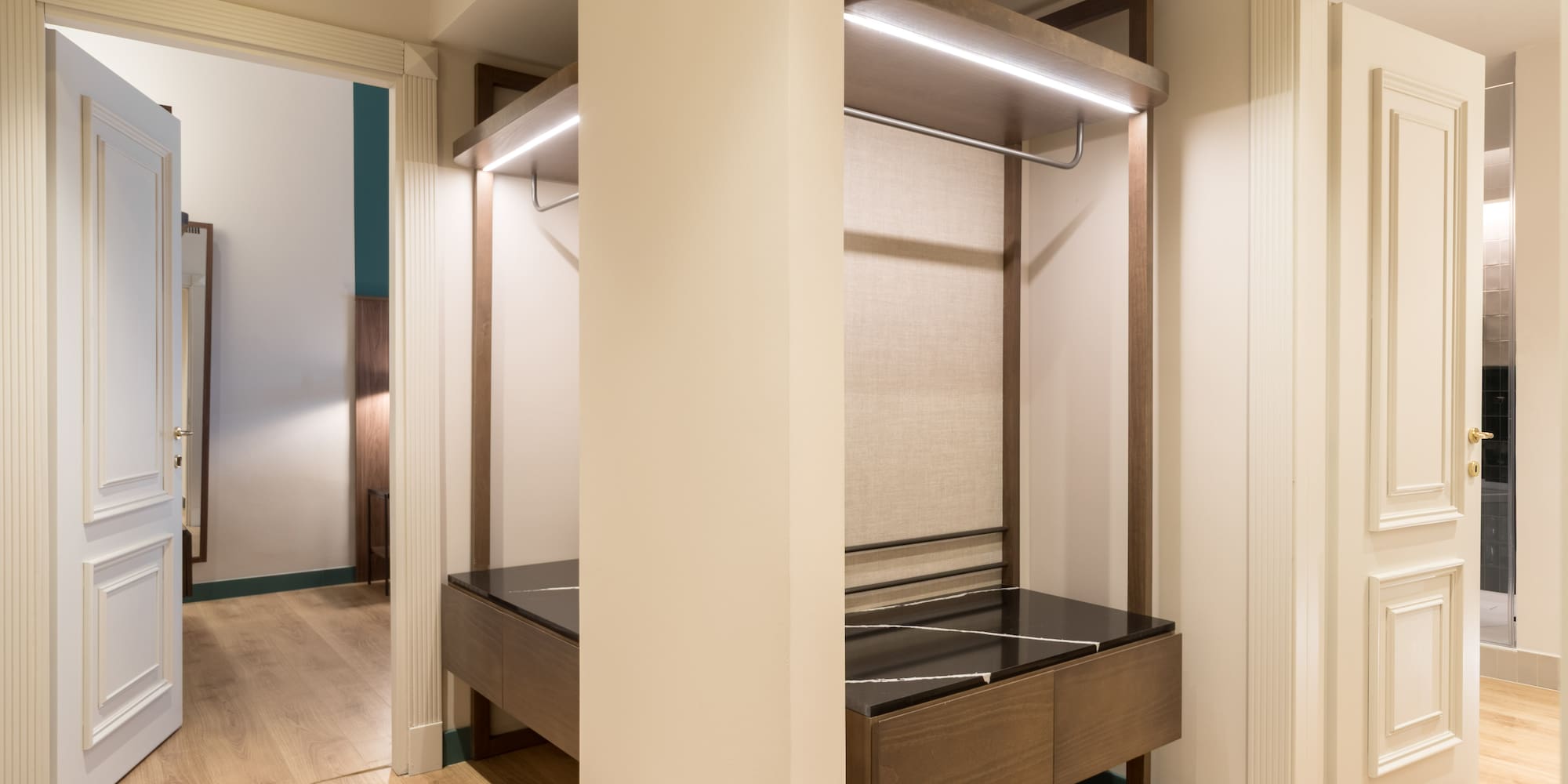 a closet with a bed and a shelf