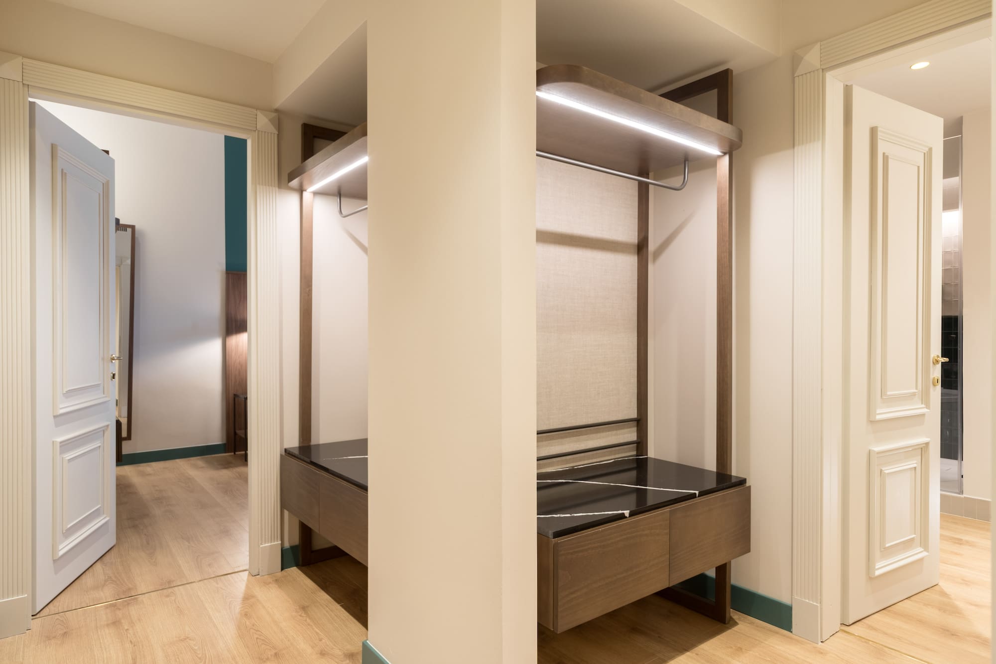 a closet with a bed and a shelf