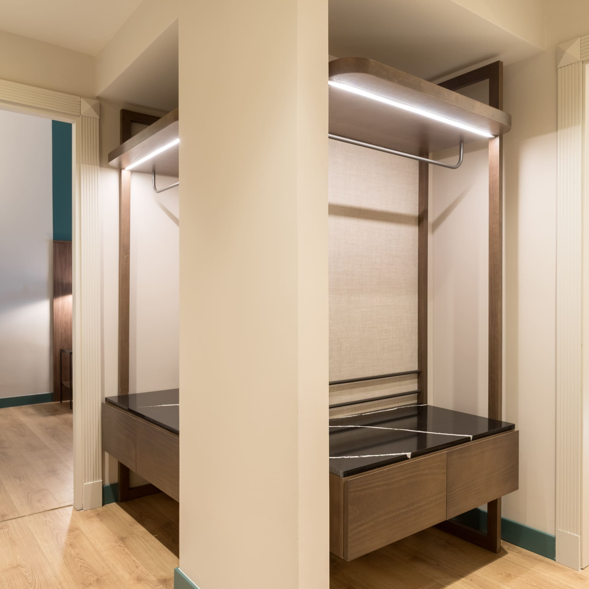 a closet with a bed and a shelf