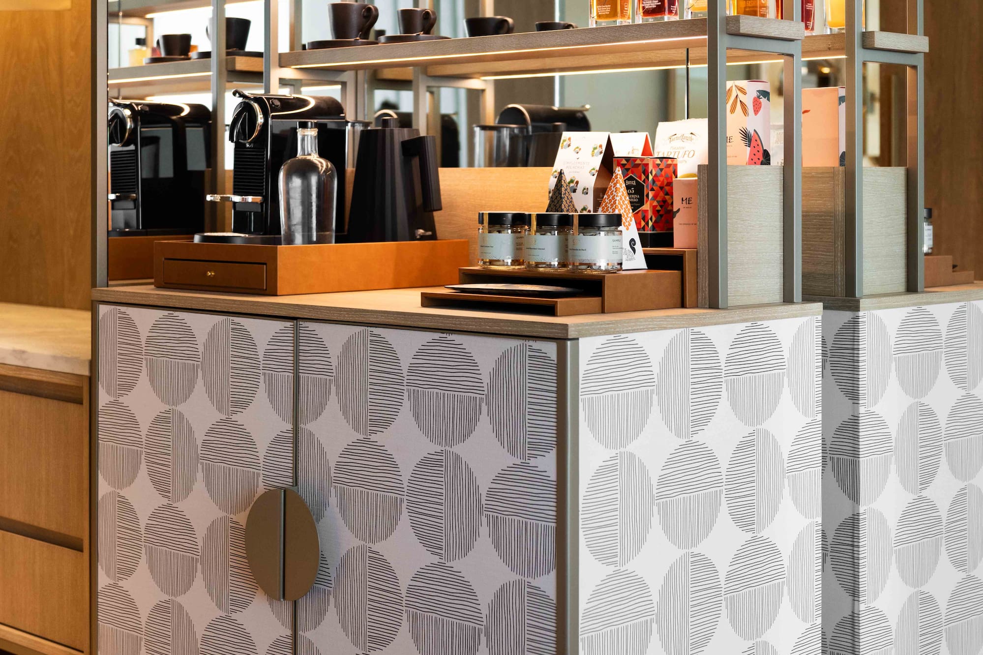 a counter with shelves and objects on it