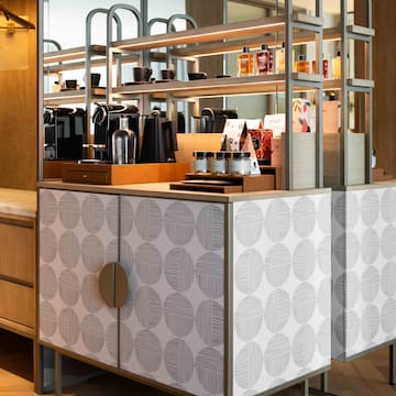 a counter with shelves and objects on it