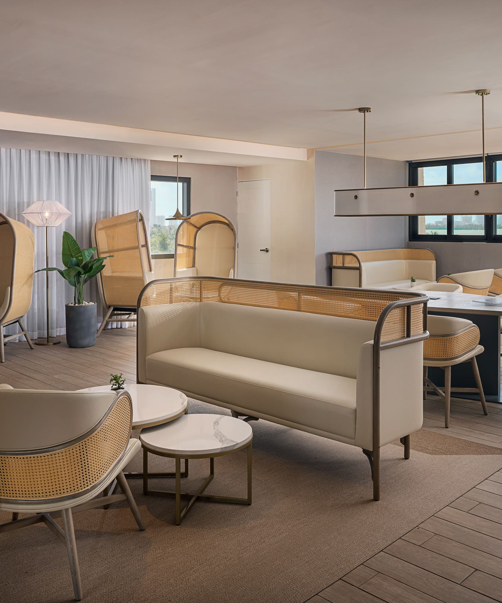 a room with a couch and chairs