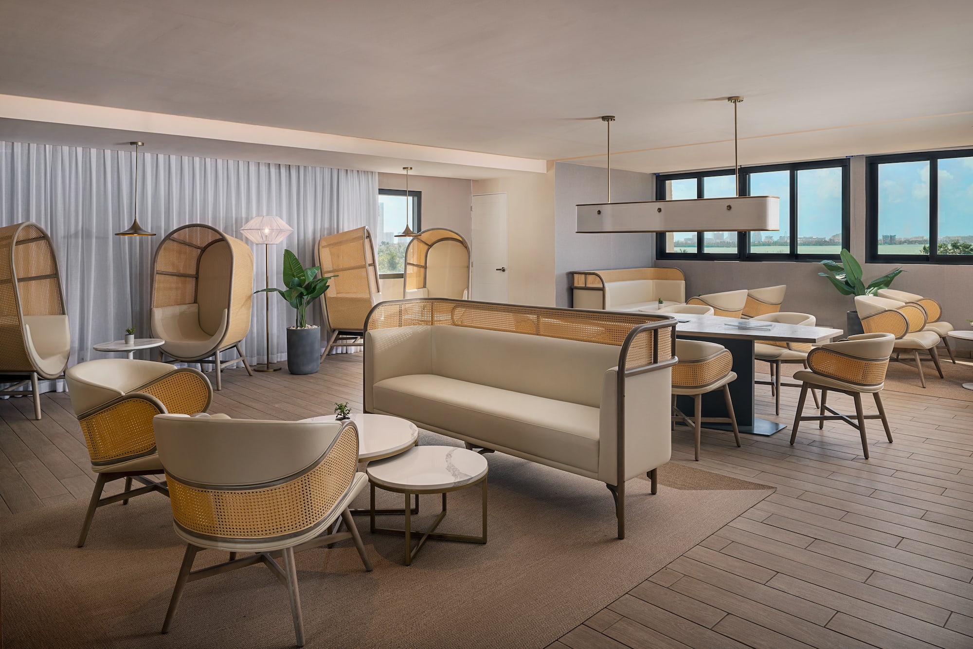 a room with a couch and chairs