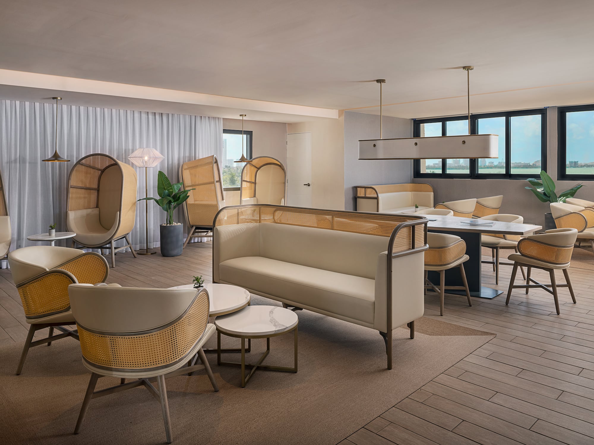 a room with a couch and chairs