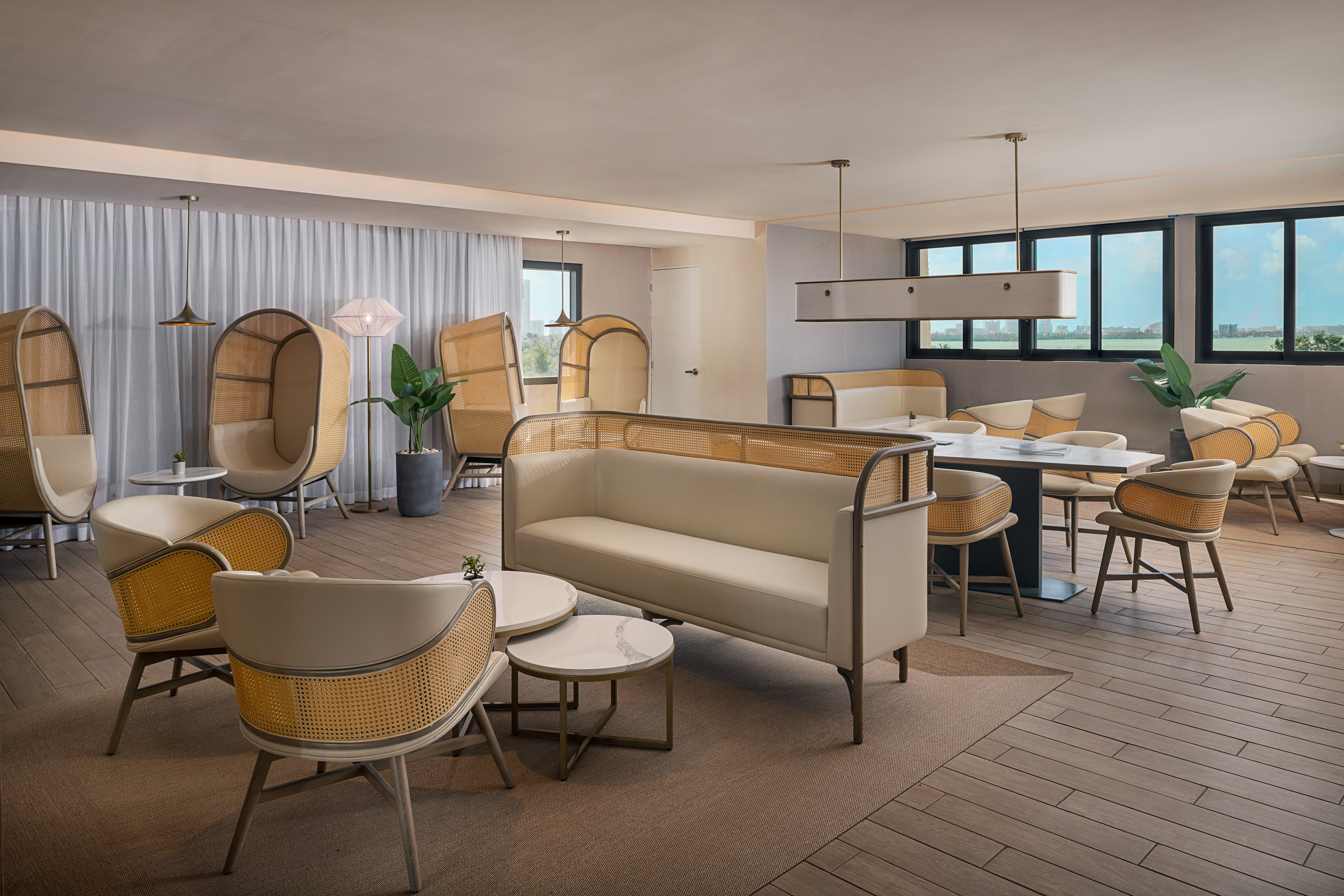 a room with a couch and chairs