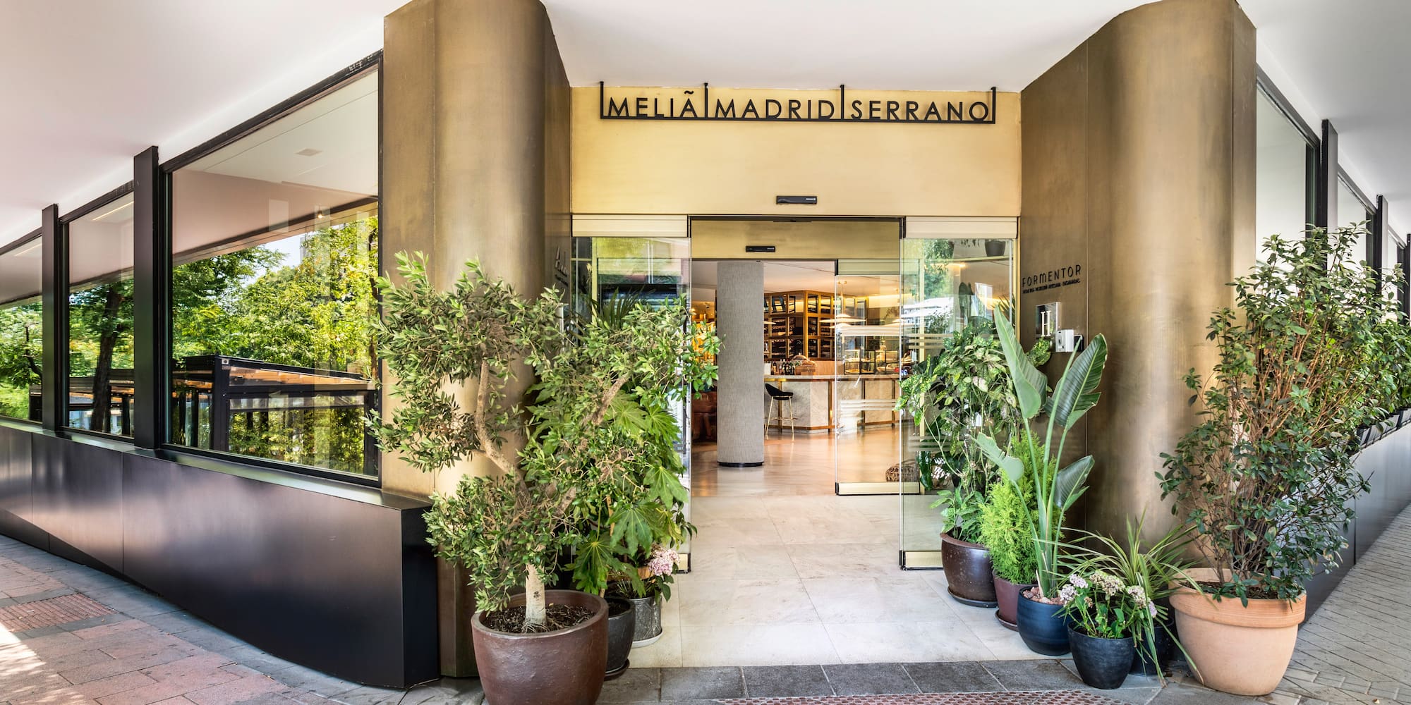 a building with plants in pots