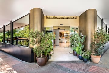 a building with plants in pots