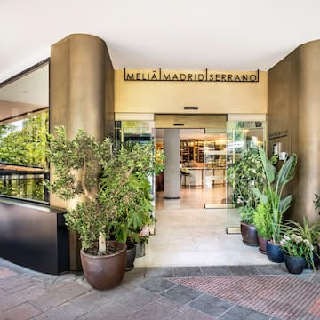 a building with plants in pots