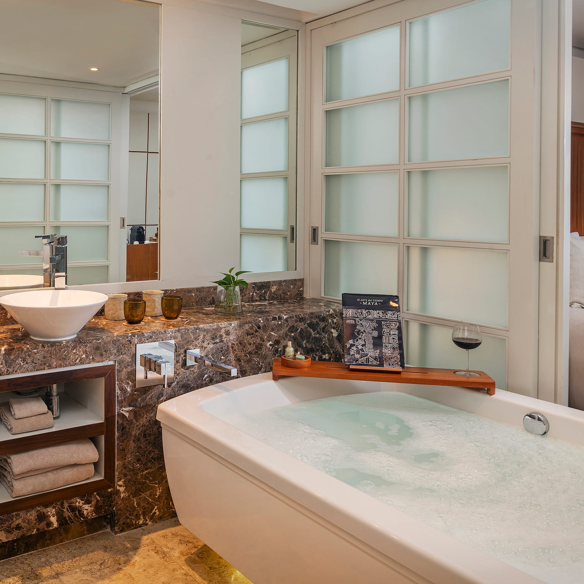 a bathroom with a tub and sink