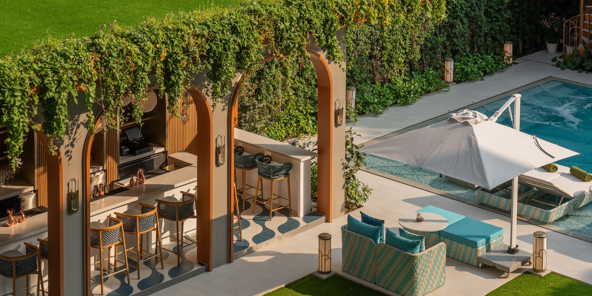 a patio with chairs and a pool