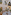 Mediterranean courtyard with checkerboard floor, wicker furniture, hanging plants.