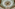 Art Nouveau stained glass dome ceiling with ornate crystal chandelier.